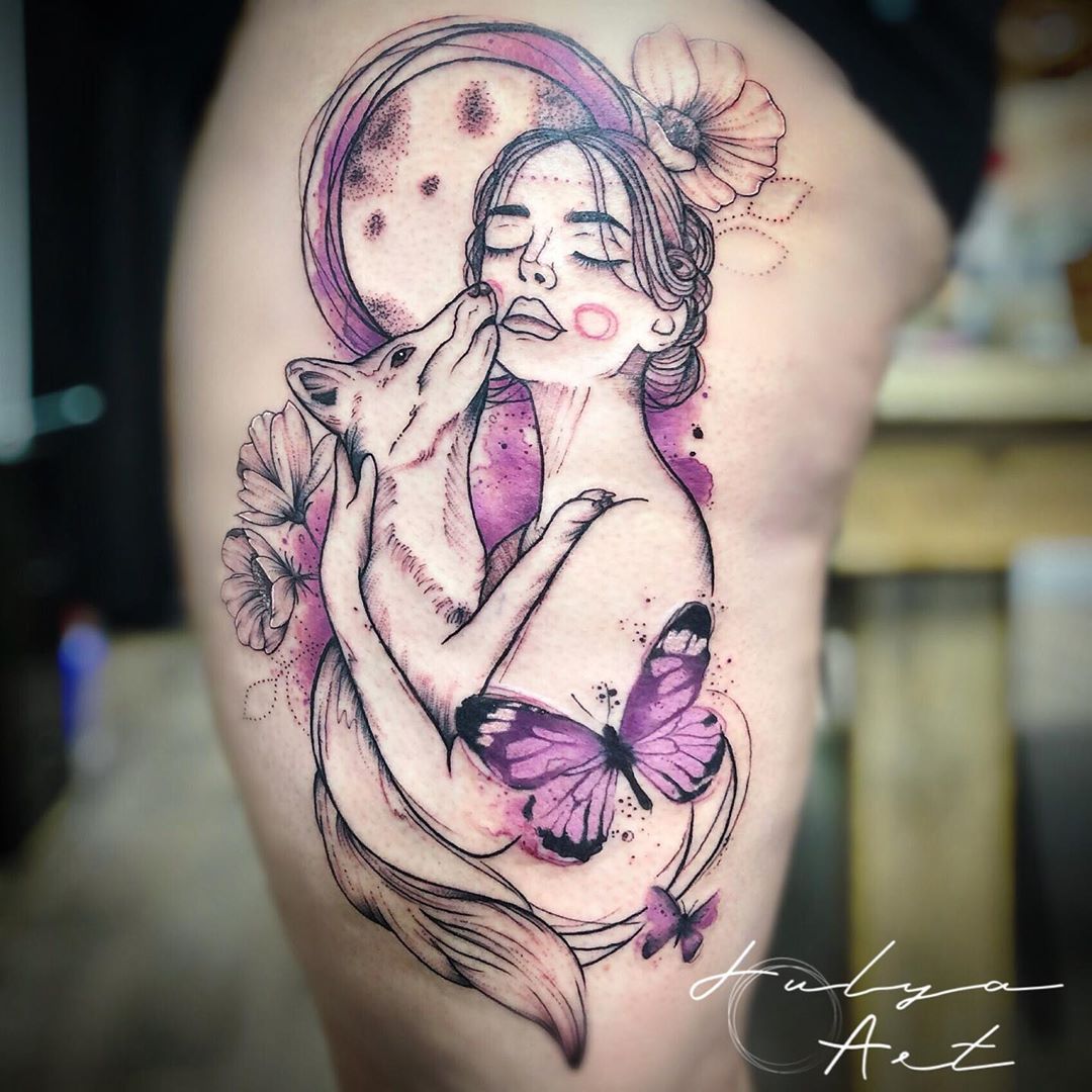 large color watercolor tattoo on woman's thigh of a surrealistic girl holding a dog with flowers and butterflies around her